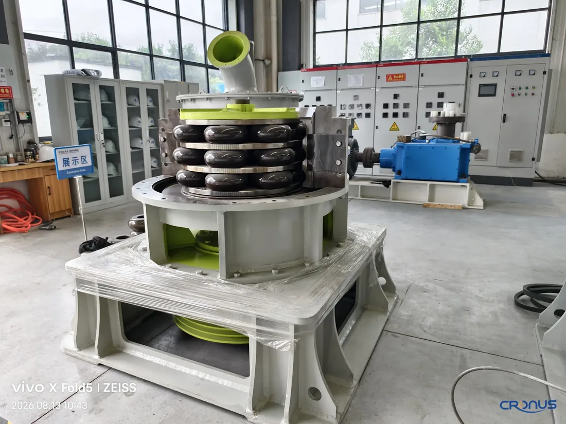 Opened Cronus ultrafine mill showing stacked grinding rings, rollers and central shaft