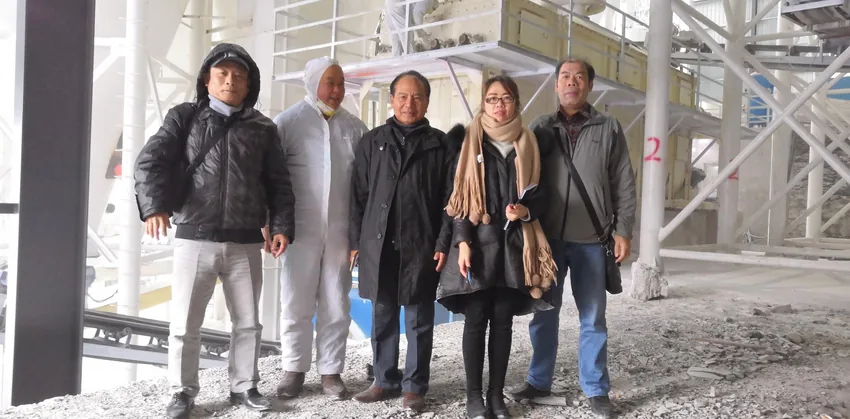 Vietnamese customers visiting a grinding equipment installation